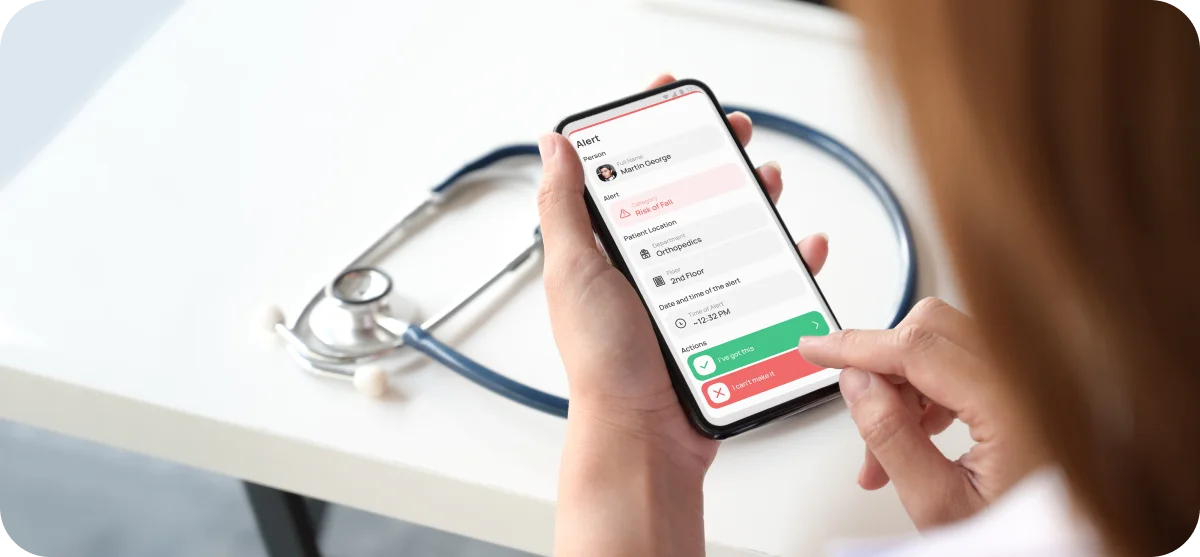 a woman on the phone checking patient monitoring