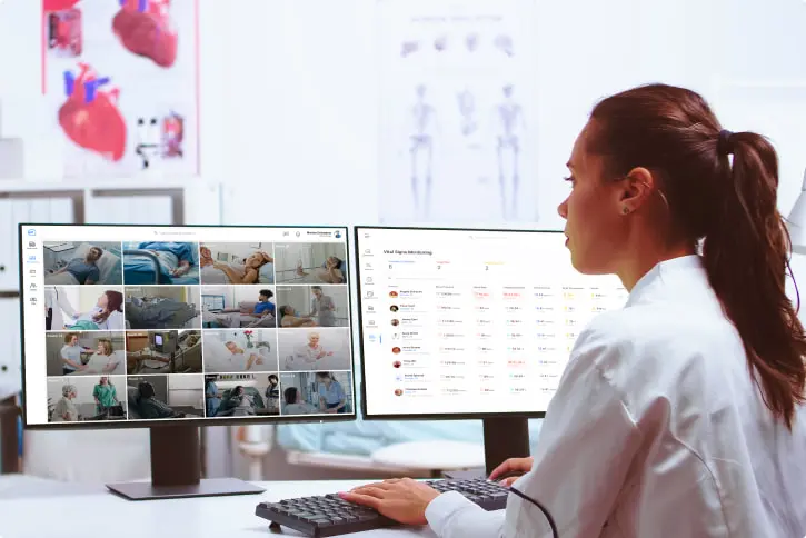 doctor monitoring patients on desktop